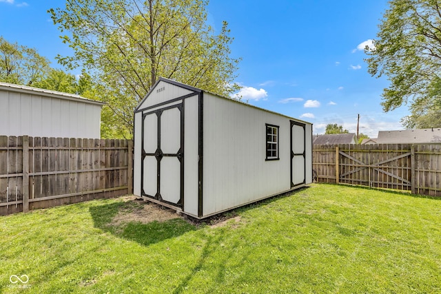 view of shed with a fenced backyard