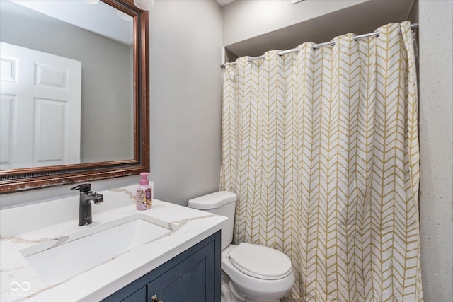 full bath featuring toilet, a shower with shower curtain, and vanity