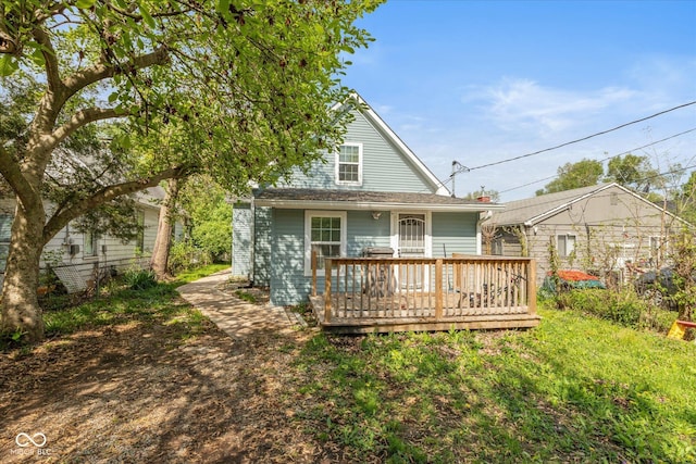 back of house featuring a wooden deck