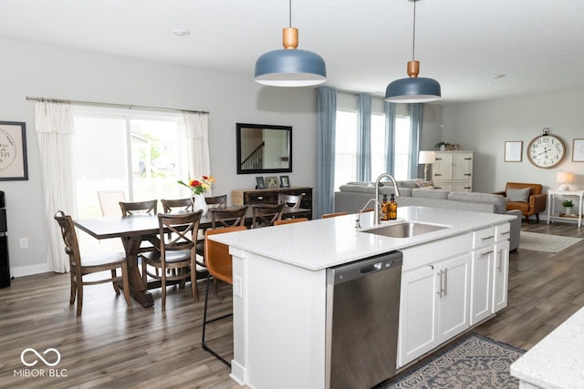 9176 Springbrook Dr, Pendleton, IN 46064 - kitchen featuring dishwasher, a sink, open floor plan, white cabinets, and dark wood-type flooring