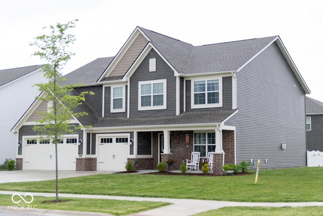 9176 Springbrook Dr, Pendleton, IN 46064 - craftsman-style home with a porch, driveway, brick siding, a front lawn, and an attached garage