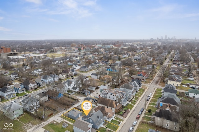 birds eye view of property with a residential view