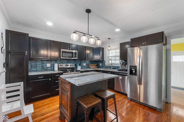 155 N Franklin Rd, Indianapolis, IN 46219 - kitchen with light stone countertops, appliances with stainless steel finishes, light wood finished floors, and tasteful backsplash