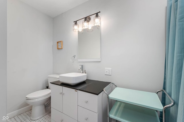 155 N Franklin Rd, Indianapolis, IN 46219 - full bathroom featuring vanity, tile patterned flooring, baseboards, and toilet