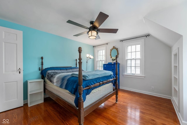 155 N Franklin Rd, Indianapolis, IN 46219 - bedroom with baseboards, a ceiling fan, wood finished floors, and vaulted ceiling