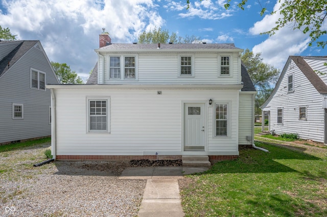 155 N Franklin Rd, Indianapolis, IN 46219 - back of house featuring a lawn, a chimney, a shingled roof, and entry steps