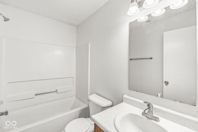 bathroom featuring vanity, visible vents, bathing tub / shower combination, toilet, and a textured ceiling