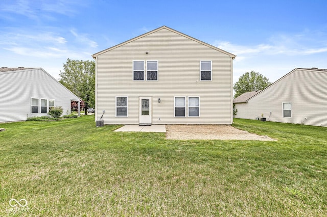 back of house with a lawn, central AC unit, and a patio area