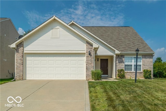 5708 Outer Bank Rd, Indianapolis, IN 46239 - view of front of home with driveway, brick siding, a front yard, a garage, and a shingled roof
