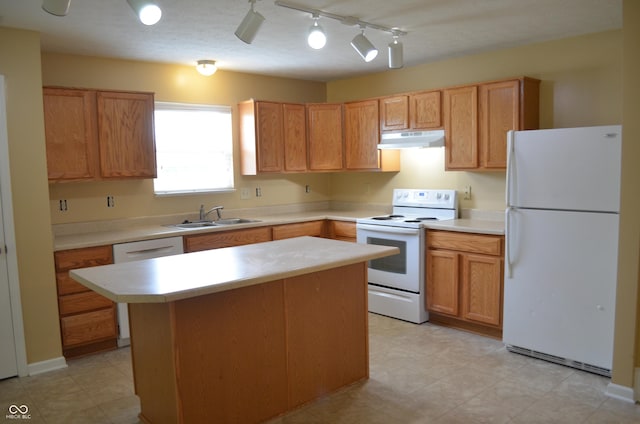 5708 Outer Bank Rd, Indianapolis, IN 46239 - kitchen featuring white appliances, under cabinet range hood, light countertops, and a kitchen island