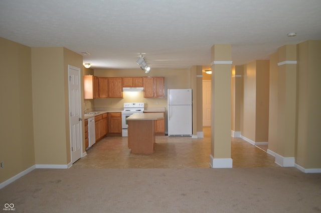 5708 Outer Bank Rd, Indianapolis, IN 46239 - kitchen featuring white appliances, under cabinet range hood, light carpet, light countertops, and a kitchen island