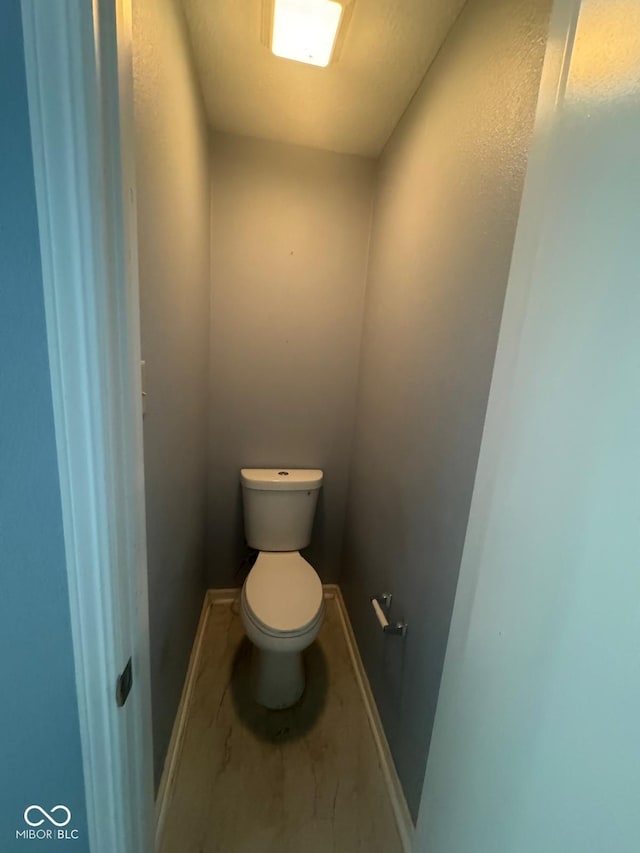317 Legacy Blvd, Greenwood, IN 46143 - bathroom featuring baseboards and toilet