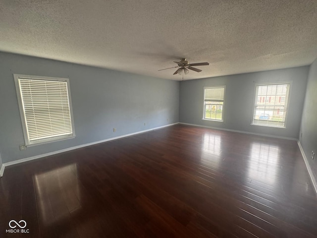 317 Legacy Blvd, Greenwood, IN 46143 - unfurnished room with baseboards, a ceiling fan, a textured ceiling, and wood finished floors