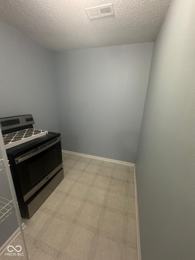 317 Legacy Blvd, Greenwood, IN 46143 - interior space with a textured ceiling, visible vents, baseboards, and light floors