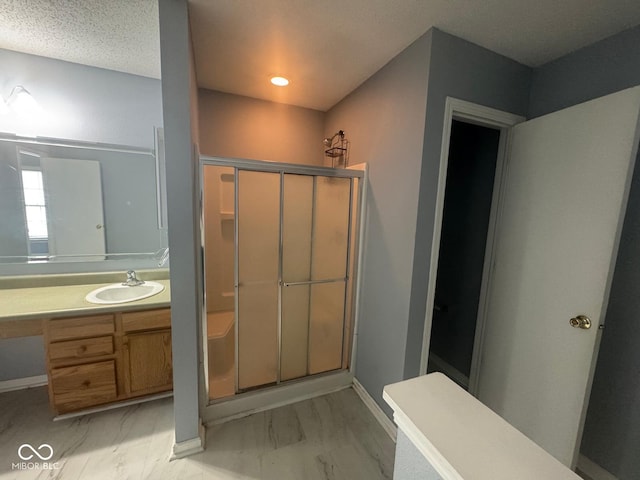 317 Legacy Blvd, Greenwood, IN 46143 - full bath featuring vanity, baseboards, marble finish floor, and a stall shower