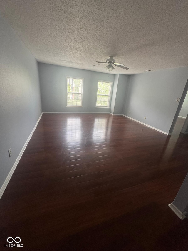 317 Legacy Blvd, Greenwood, IN 46143 - spare room featuring baseboards, a textured ceiling, ceiling fan, and wood finished floors