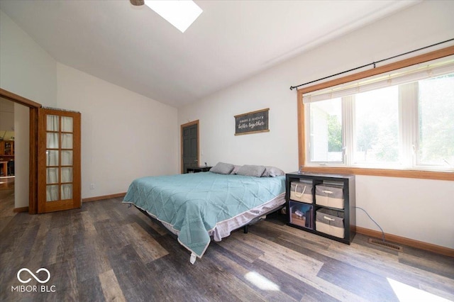 11815 E Pocahontas Dr, Greencastle, IN 46135 - bedroom with lofted ceiling, wood finished floors, baseboards, and a skylight