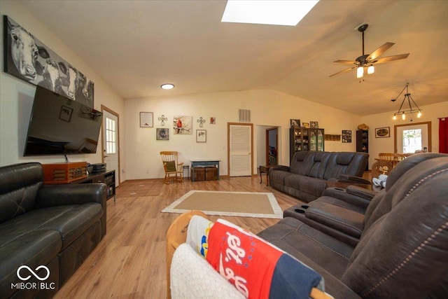11815 E Pocahontas Dr, Greencastle, IN 46135 - living room with lofted ceiling, light wood-type flooring, a skylight, a ceiling fan, and baseboards