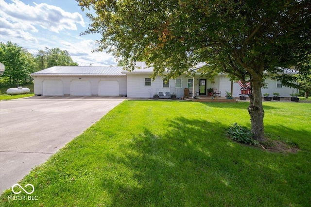 11815 E Pocahontas Dr, Greencastle, IN 46135 - view of front of home featuring a front yard, an attached garage, and driveway