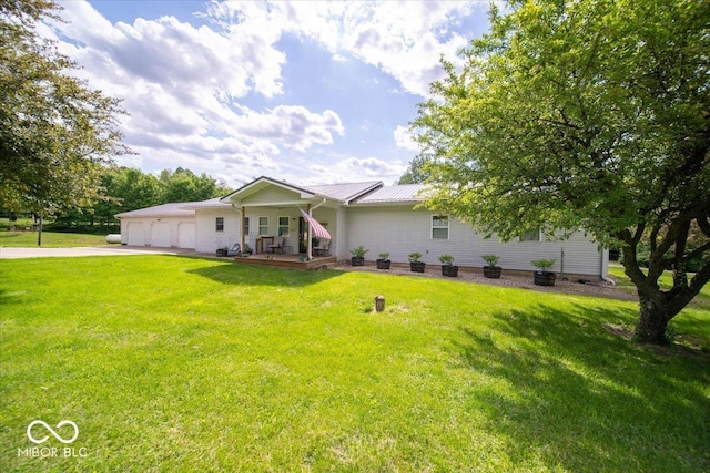 11815 E Pocahontas Dr, Greencastle, IN 46135 - ranch-style home featuring driveway, an attached garage, a front yard, and metal roof