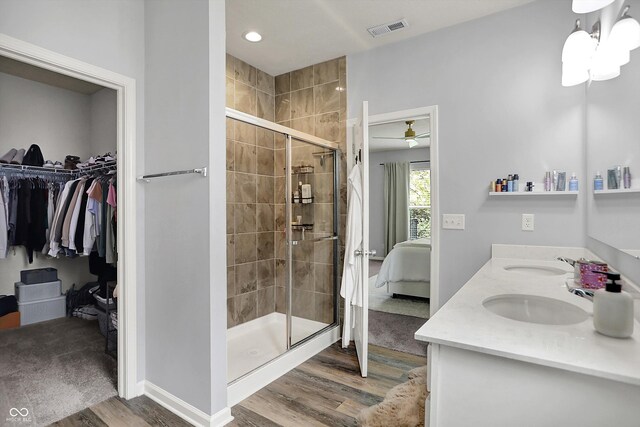 5580 Pintail Ln, Greenwood, IN 46143 - bathroom featuring wood finished floors, connected bathroom, a shower stall, baseboards, and recessed lighting