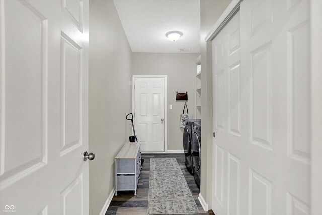 5580 Pintail Ln, Greenwood, IN 46143 - interior space featuring separate washer and dryer, baseboards, and dark wood-style floors
