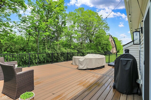 5580 Pintail Ln, Greenwood, IN 46143 - wooden terrace with area for grilling and view of scattered trees