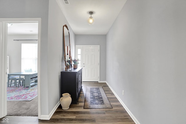 5580 Pintail Ln, Greenwood, IN 46143 - foyer entrance with dark wood-style floors and baseboards