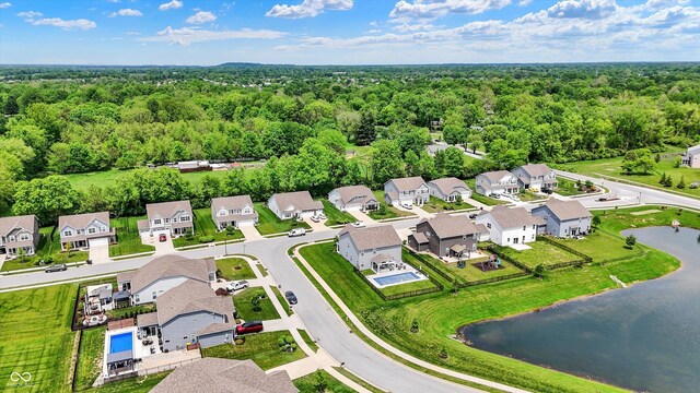 5580 Pintail Ln, Greenwood, IN 46143 - aerial perspective of suburban area featuring a heavily wooded area and a nearby body of water