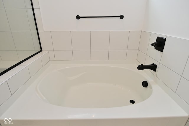 full bathroom with a tub to relax in