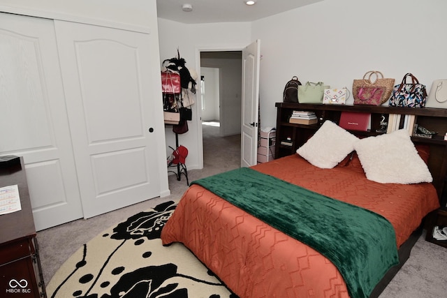 bedroom with carpet floors and a closet