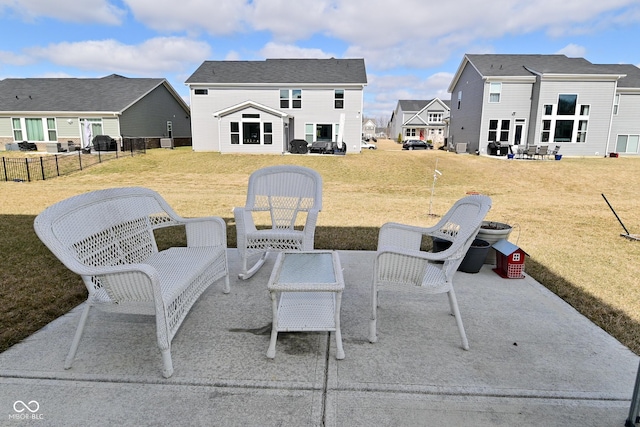 view of patio / terrace featuring fence and a residential view