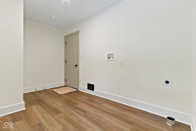 washroom with laundry area, wood finished floors, baseboards, electric dryer hookup, and washer hookup