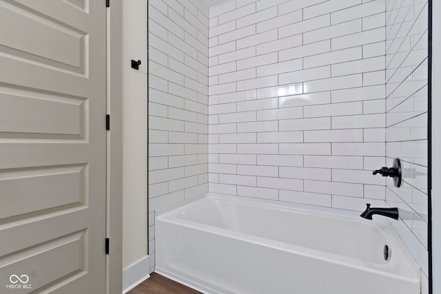 full bathroom featuring shower / bath combination and wood finished floors
