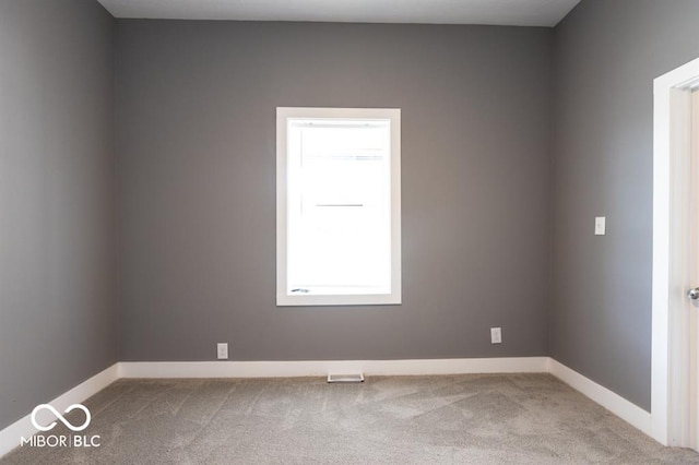 empty room with carpet flooring and baseboards