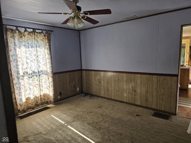 carpeted empty room with ceiling fan