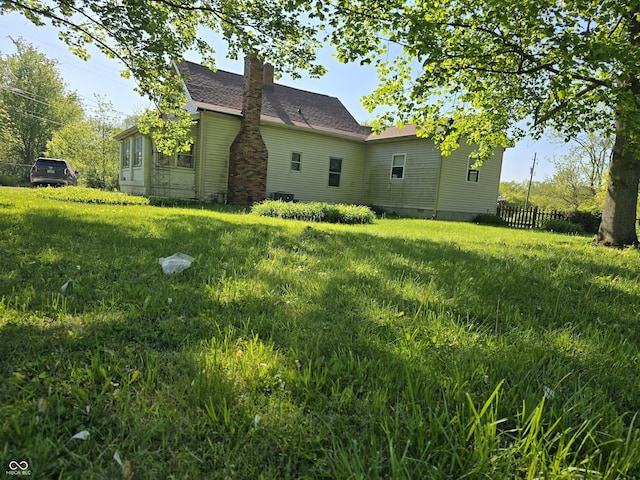 view of side of property with a chimney
