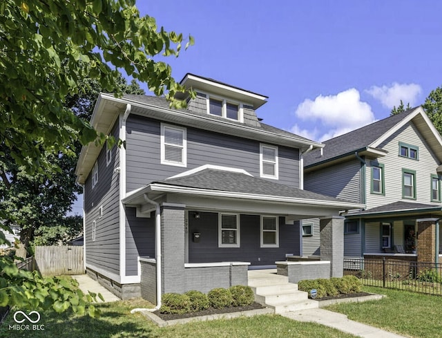 2940 N Park Ave, Indianapolis, IN 46205 - american foursquare style home with a porch and a shingled roof