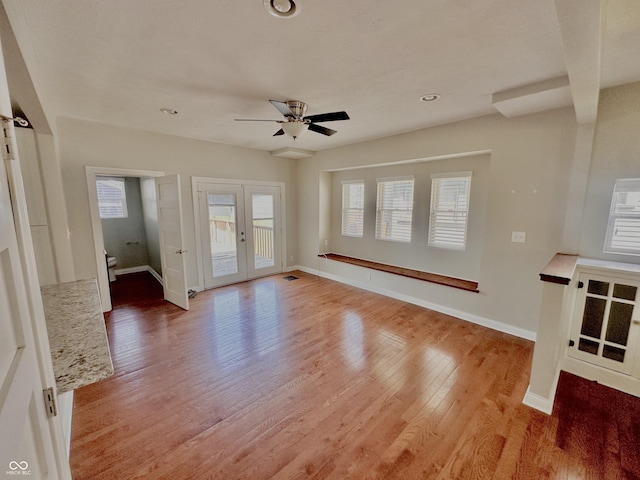 2940 N Park Ave, Indianapolis, IN 46205 - unfurnished living room featuring healthy amount of natural light, ceiling fan, light wood-style floors, and recessed lighting