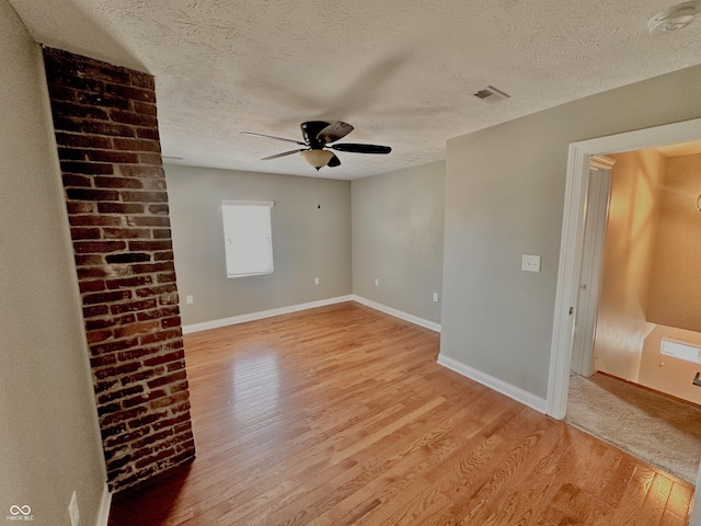 2940 N Park Ave, Indianapolis, IN 46205 - spare room featuring light wood finished floors, a textured ceiling, ceiling fan, baseboards, and a smoke detector