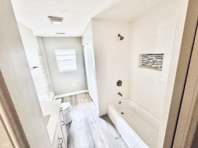2940 N Park Ave, Indianapolis, IN 46205 - bathroom with toilet, wood finished floors, bathing tub / shower combination, vanity, and baseboards