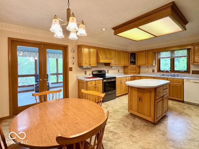kitchen with electric range, dishwasher, a sink, a chandelier, and light countertops