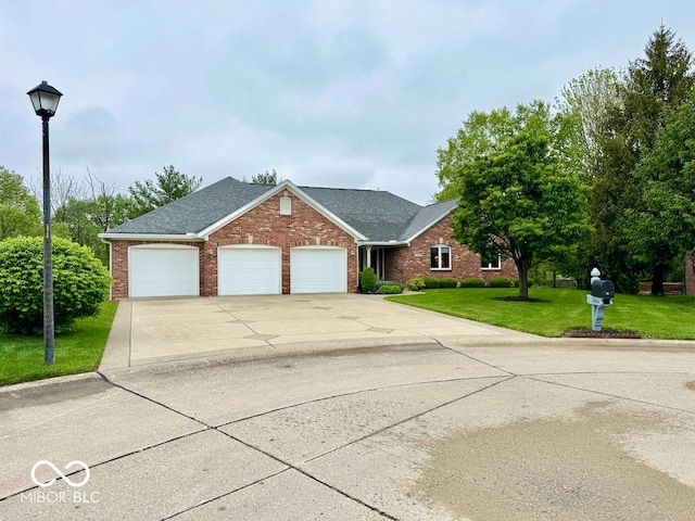 traditional home with brick siding, an attached garage, a front yard, driveway, and roof with shingles