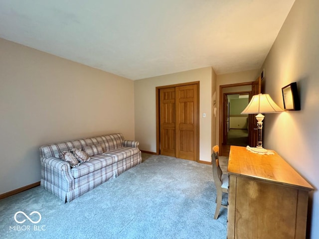 living room featuring carpet floors and baseboards