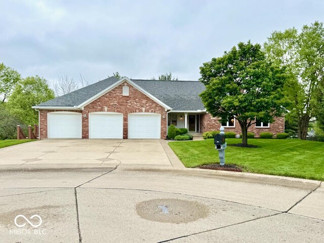 view of front facade with an attached garage, driveway, brick siding, a front lawn, and a shingled roof