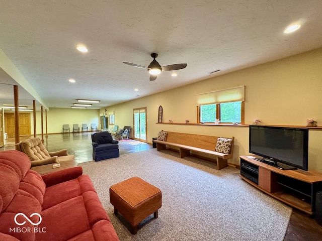 living room with recessed lighting, a ceiling fan, baseboards, and carpet floors
