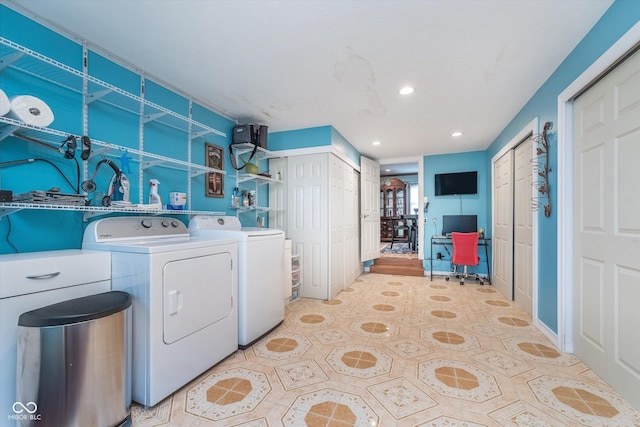 clothes washing area featuring recessed lighting, laundry area, and washing machine and dryer