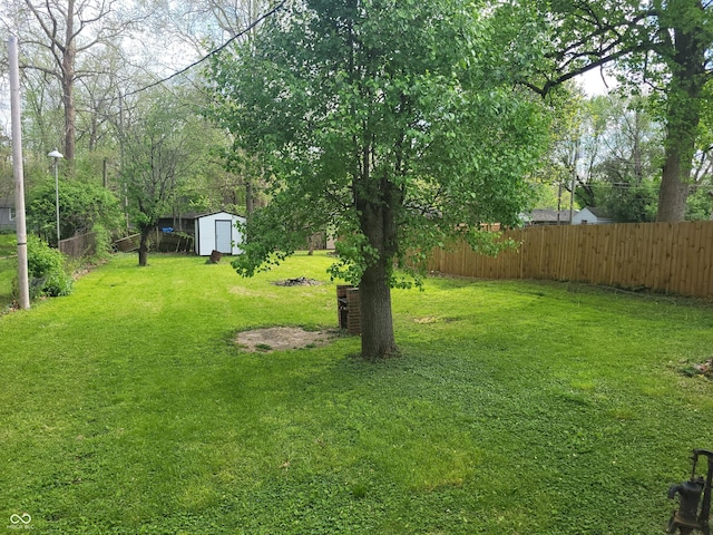 2855 Walker Ave, Indianapolis, IN 46203 - view of yard with fence, an outbuilding, and a shed