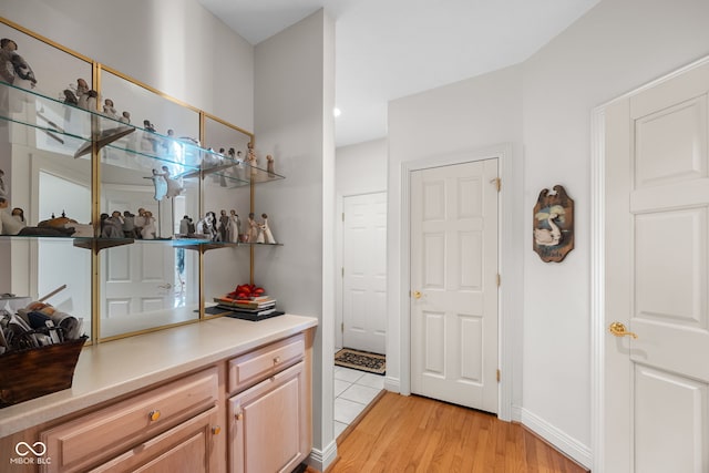 6821 Ripple Creek Dr, Lafayette, IN 47905 - bar with light wood-type flooring and baseboards