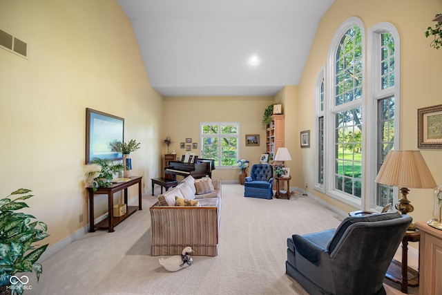 6821 Ripple Creek Dr, Lafayette, IN 47905 - carpeted living room featuring high vaulted ceiling, baseboards, and visible vents